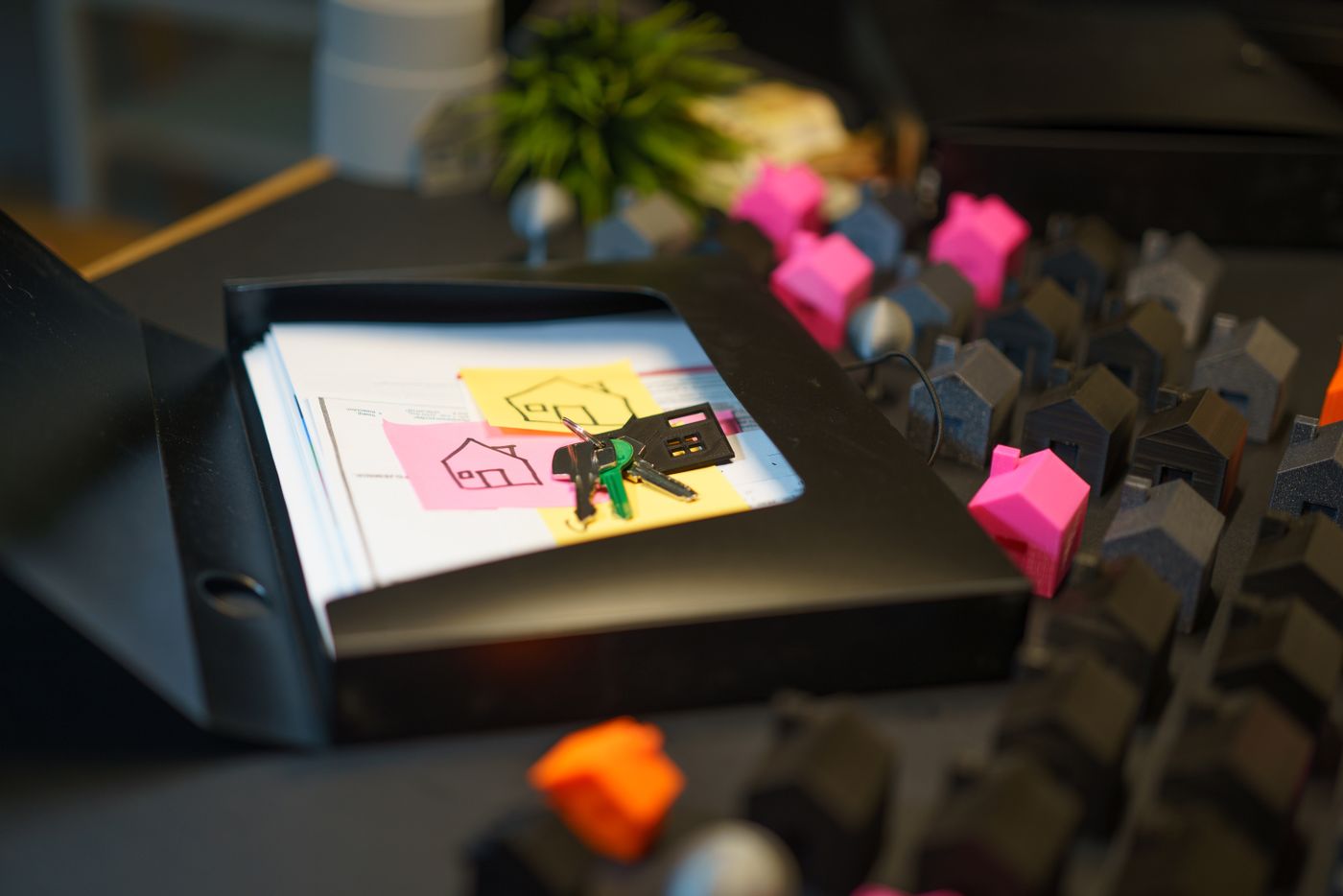 House keys and signed paperwork on a desk, a closed off-market deal